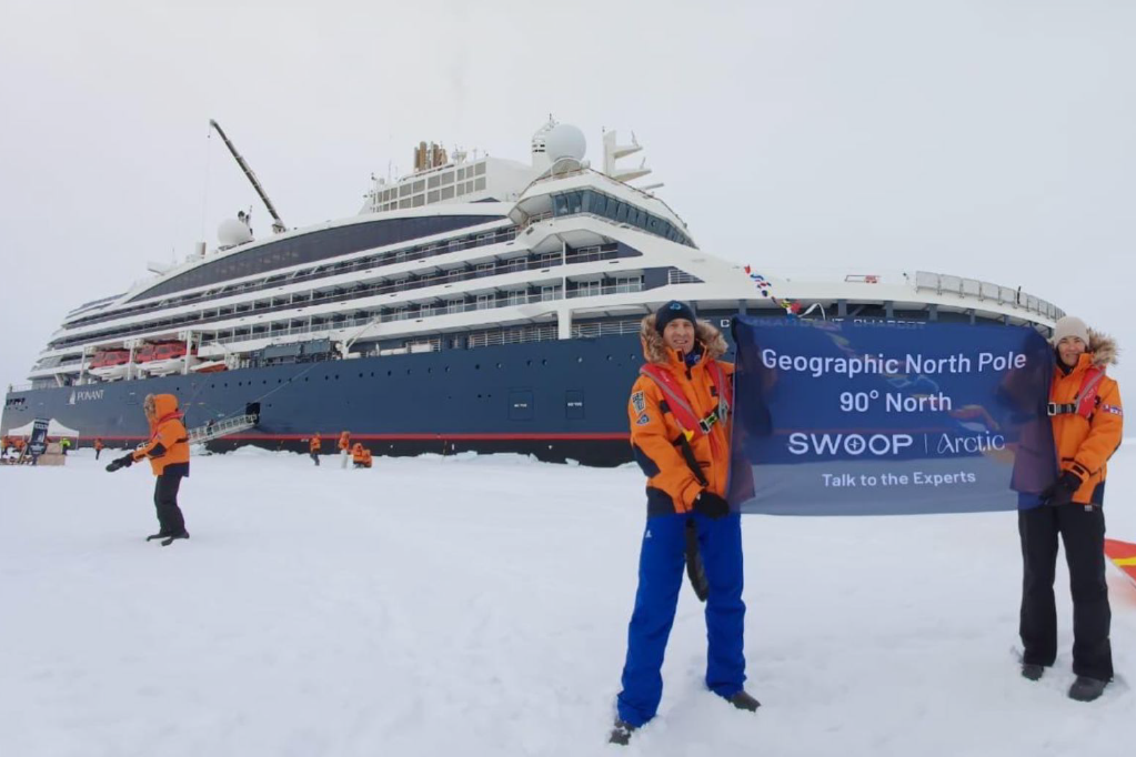 Alex’s expedition celebrating at the Geographic North Pole