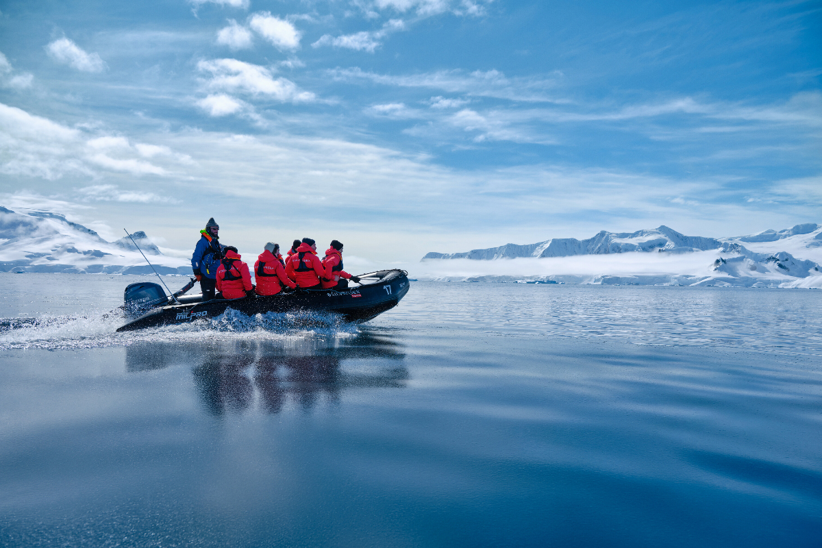 Silversea Expedition Gusts On A Zodiac In Antarctica