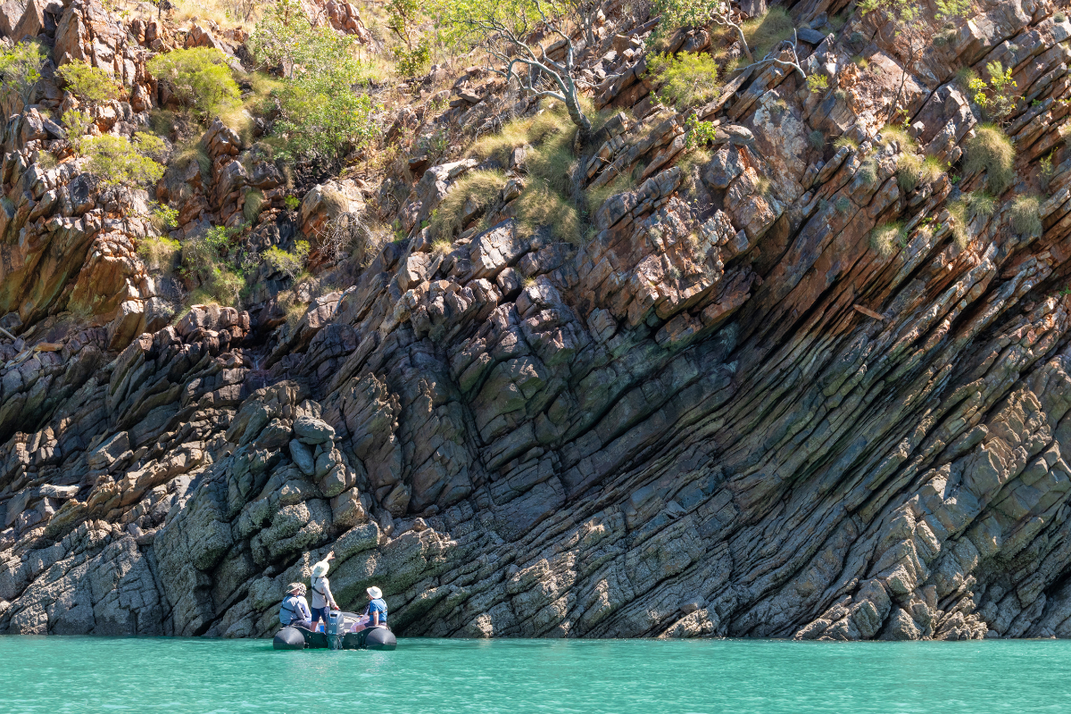 Guests exploring folded Kimberley rock formations by expedition craft